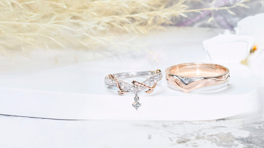 Bridal wedding bands in white and rose gold with V-shaped contour, vine engraving, pavé diamonds, and matching pair design