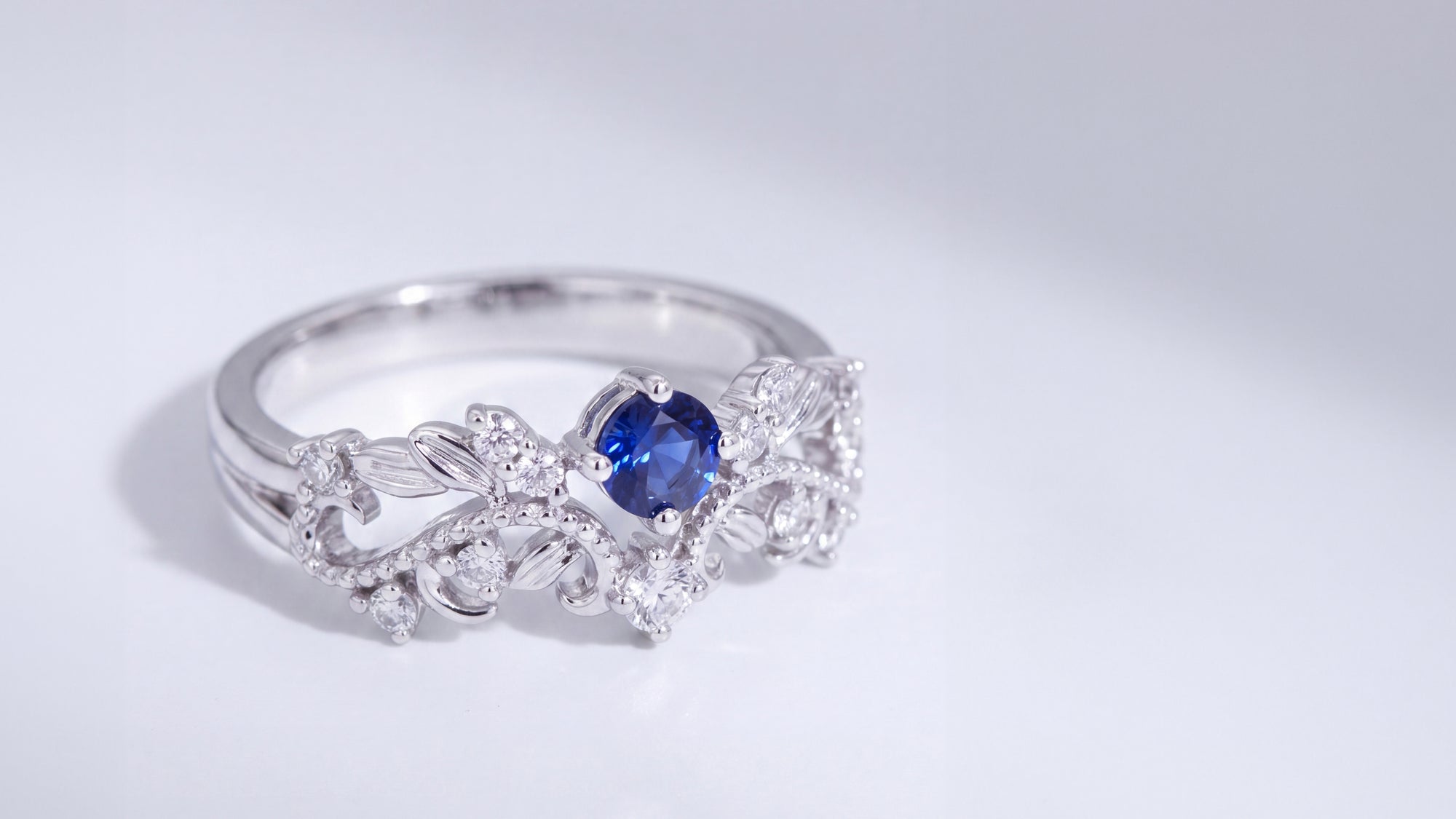 An Enchanted Bloom: The Custom Botanical Sapphire and Diamond Engagement Ring