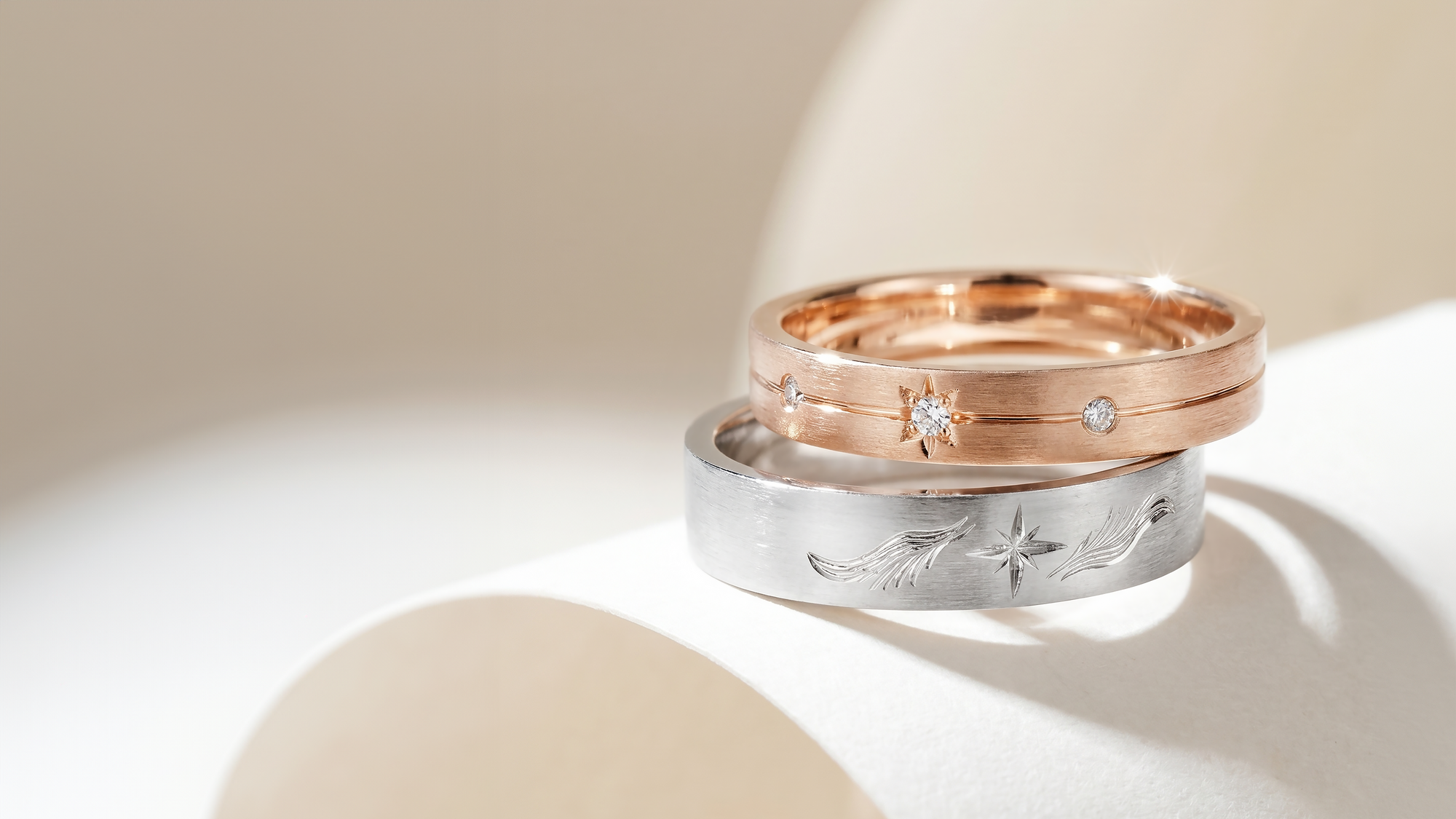 Vera — Custom Made Wedding Bands with Star and Wing Engraving in 18K White & Rose Gold