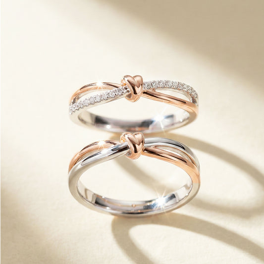 A set of rose gold and white gold wwedding band with heart motif. Lady's band has pave diamond.