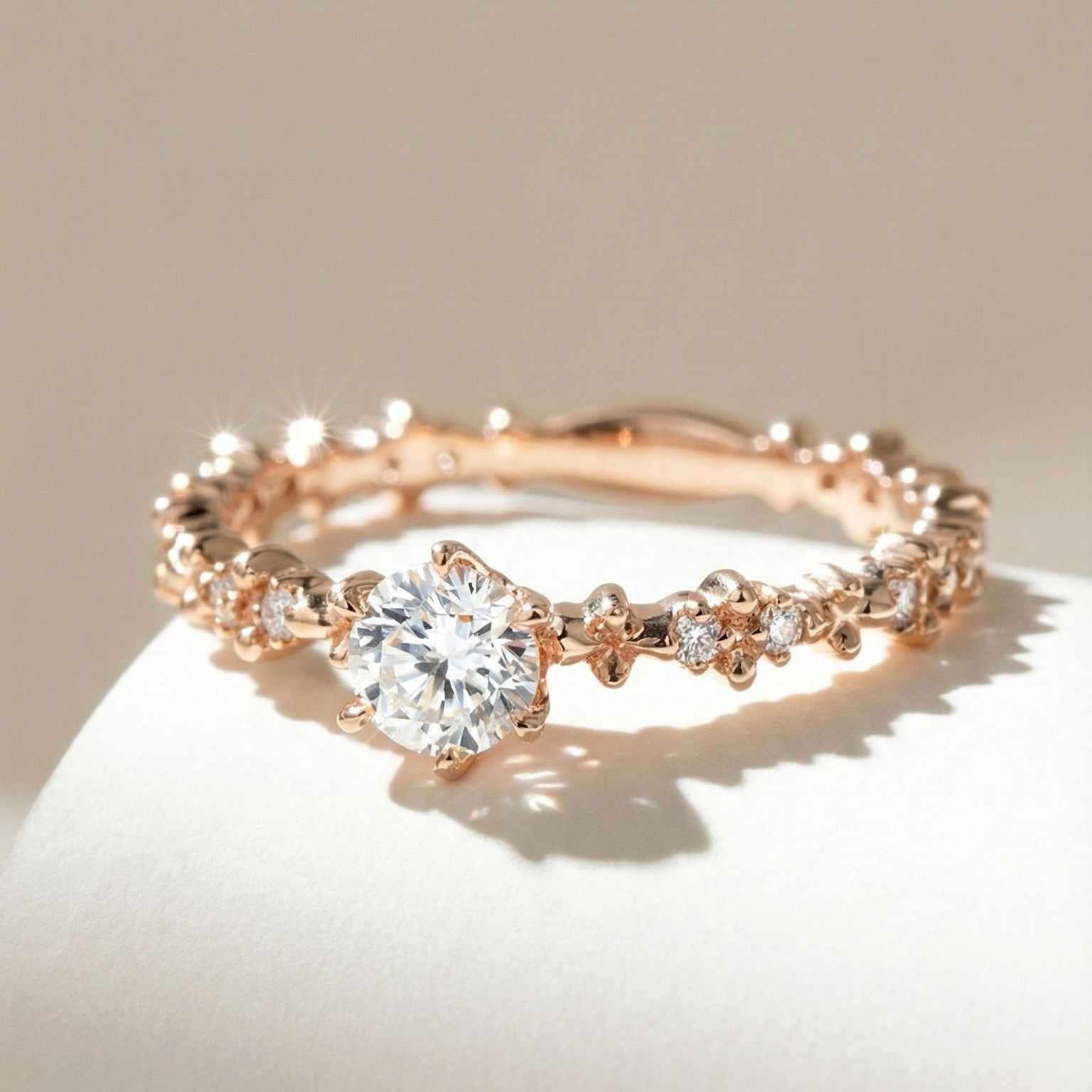 Rose gold ring with a diamond on a beige background