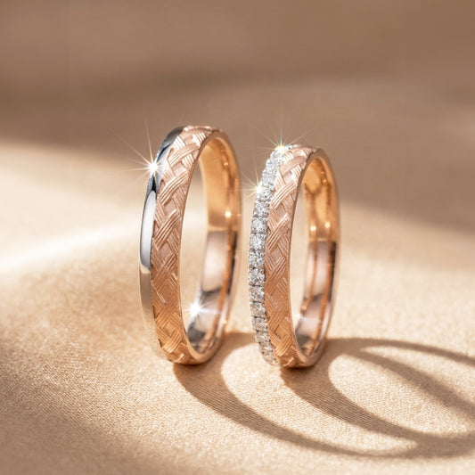 A pair of rose gold and white gold  wedding band. Lady's band has pave diamond