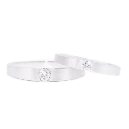 18 carat white-gold classic channel set single diamond wedding band set